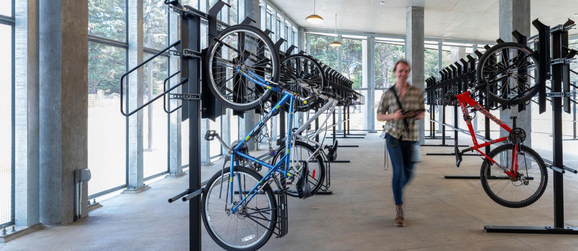 person walking in bike storage