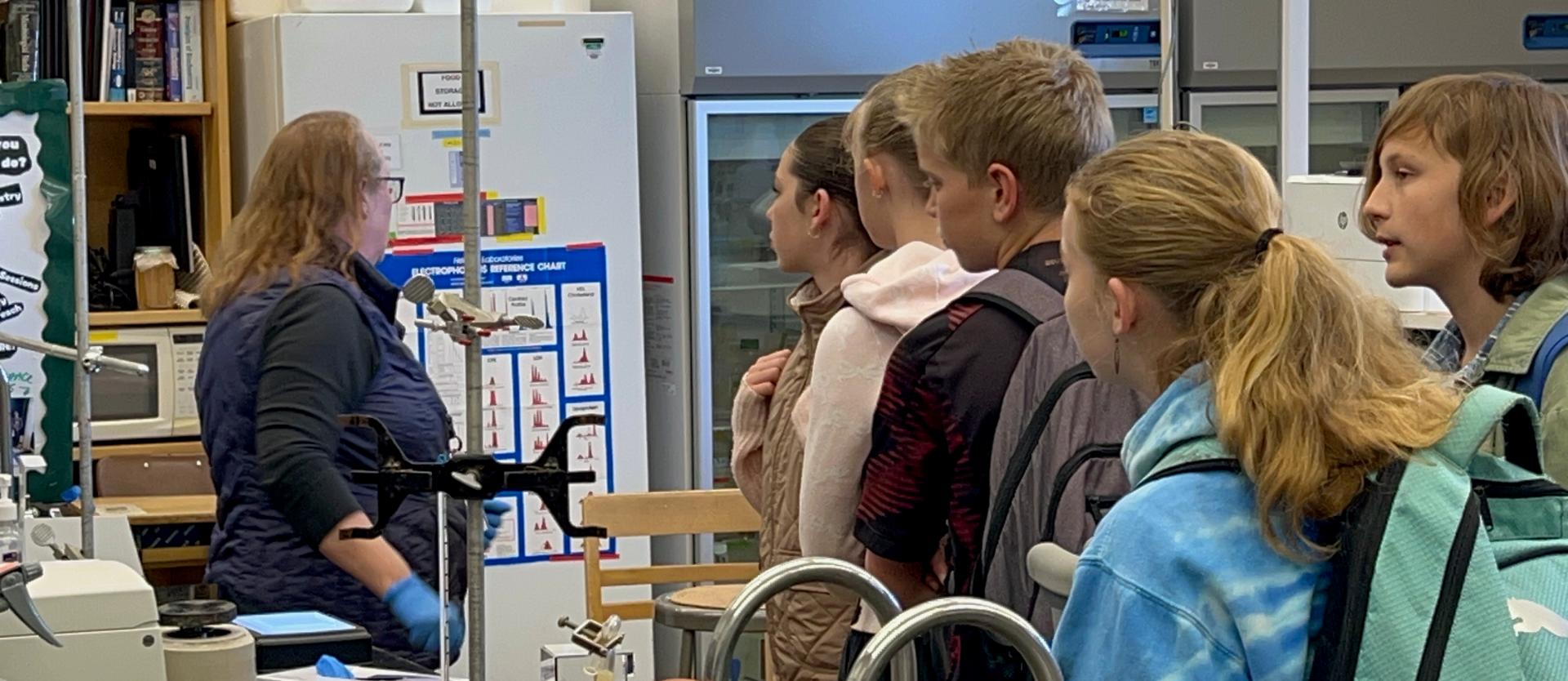 Jenny in lab with students