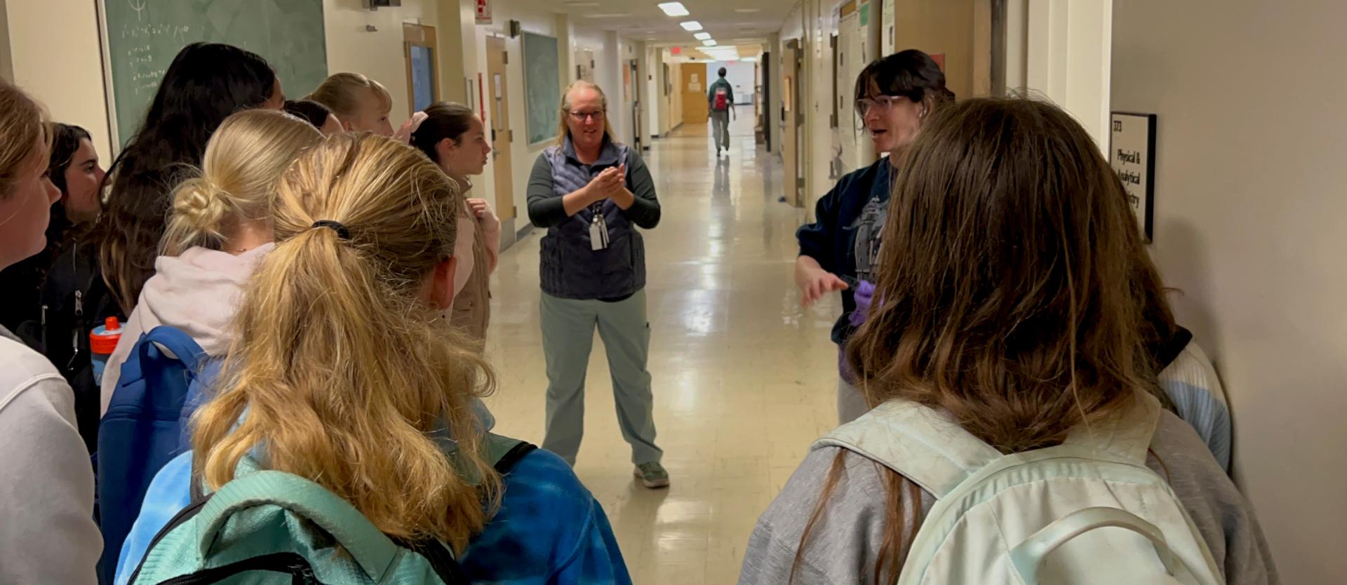 Jenny with students in hall