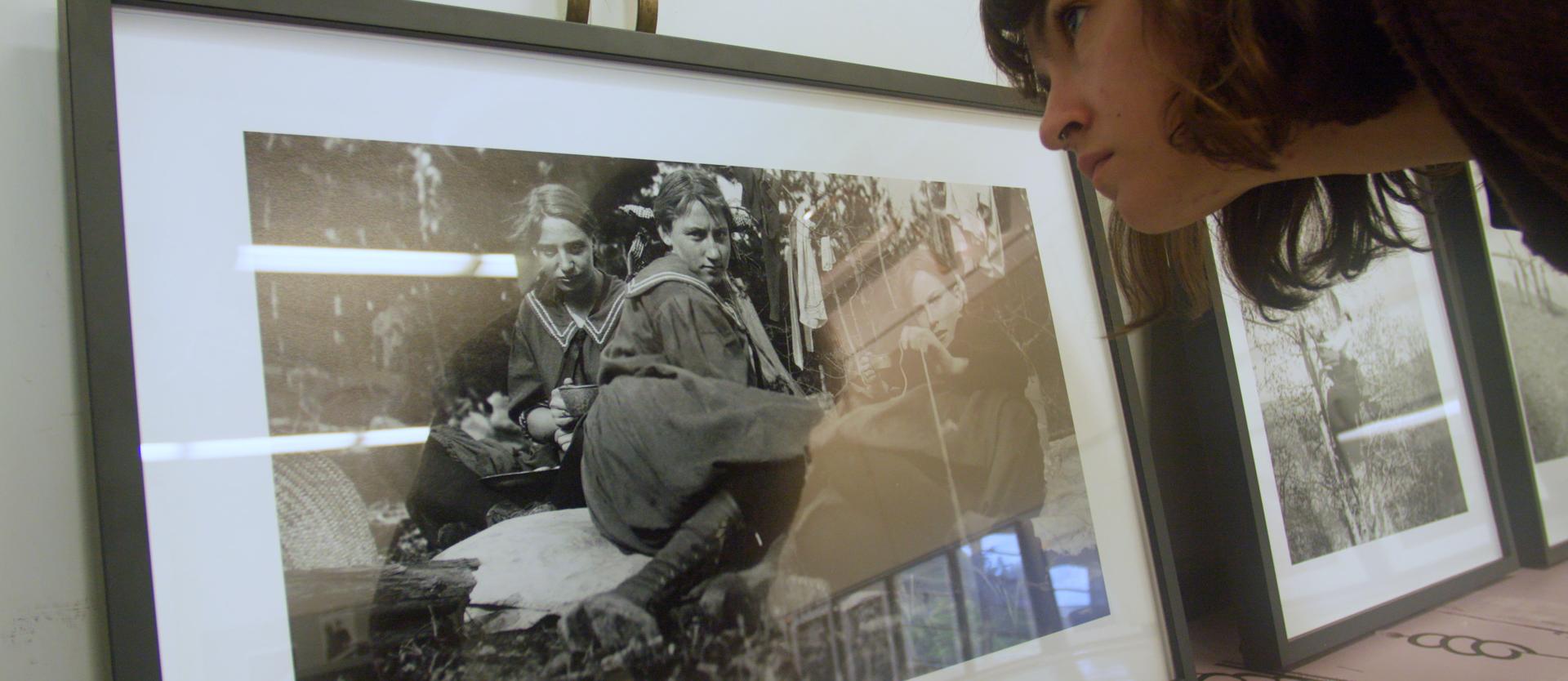 Student looks at photograph