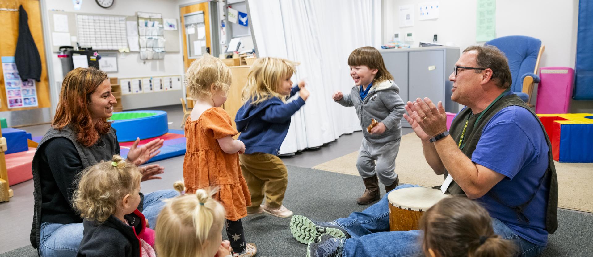 Toddlers play in a group setting