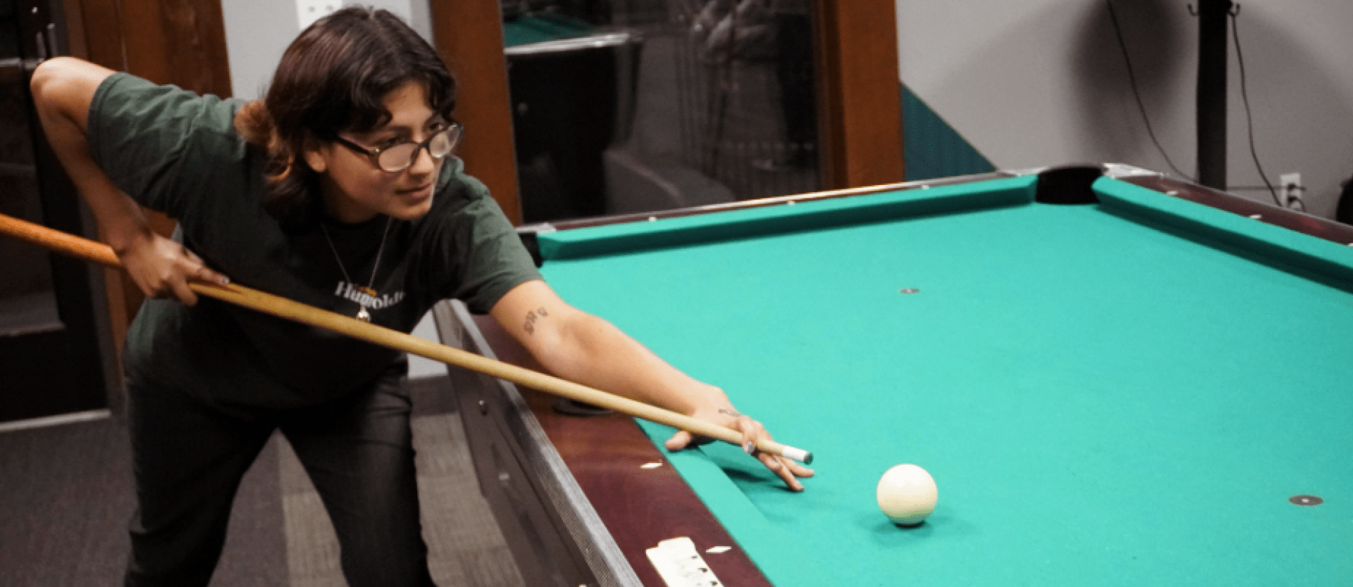 Person playing pool.
