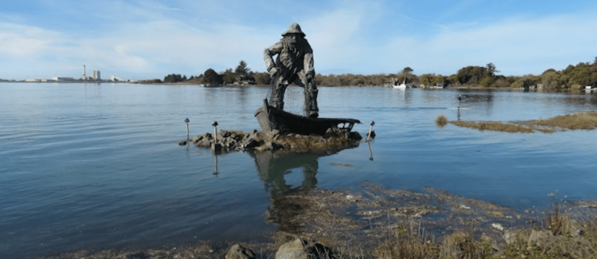 Image of the statue of a fisherman on Woodley Island partially submeregd