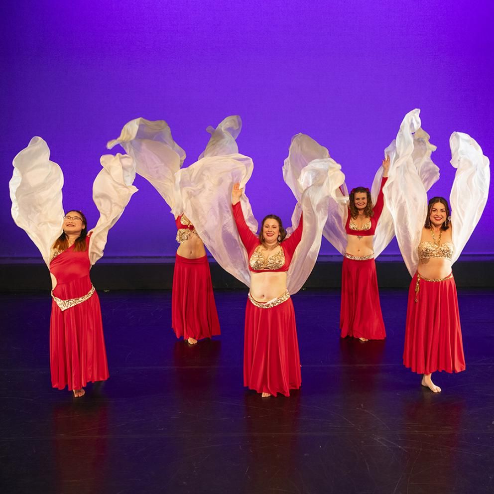 dancers in red costumes