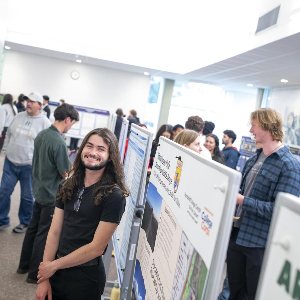 Male student in black shirt presenting at ideafest