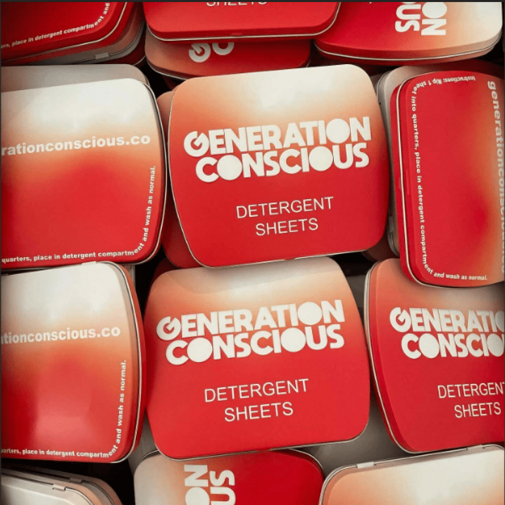 Image shows red aluminum Generation Conscious containers for laundry detergent sheets. 