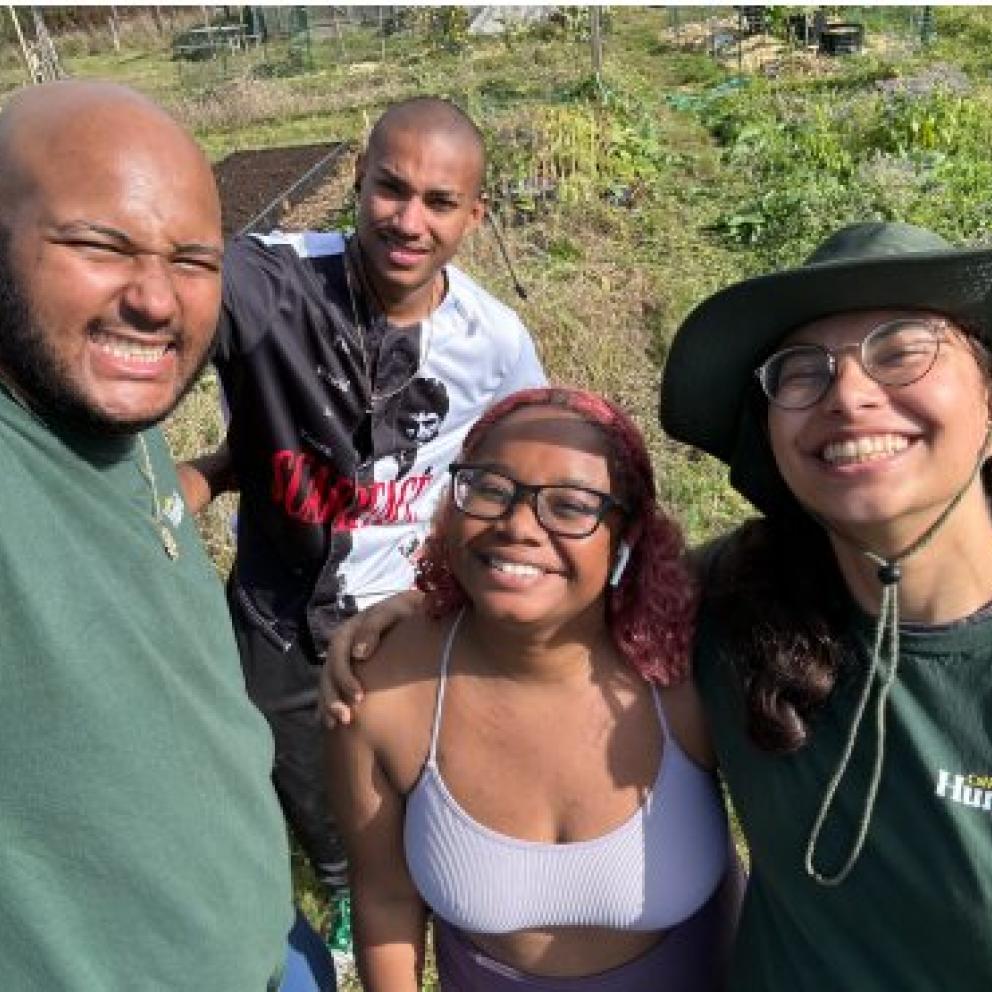 Students smiling at the farm