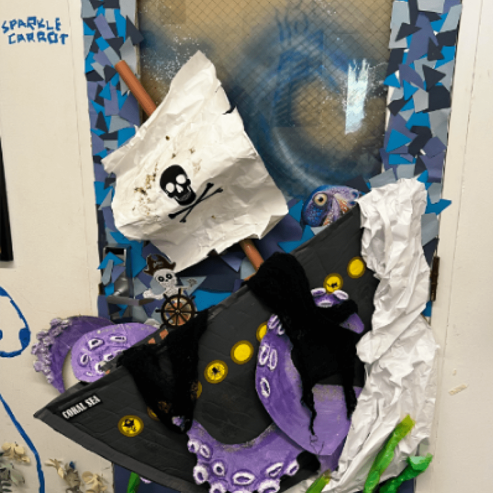 door decorated with ship and octopus 