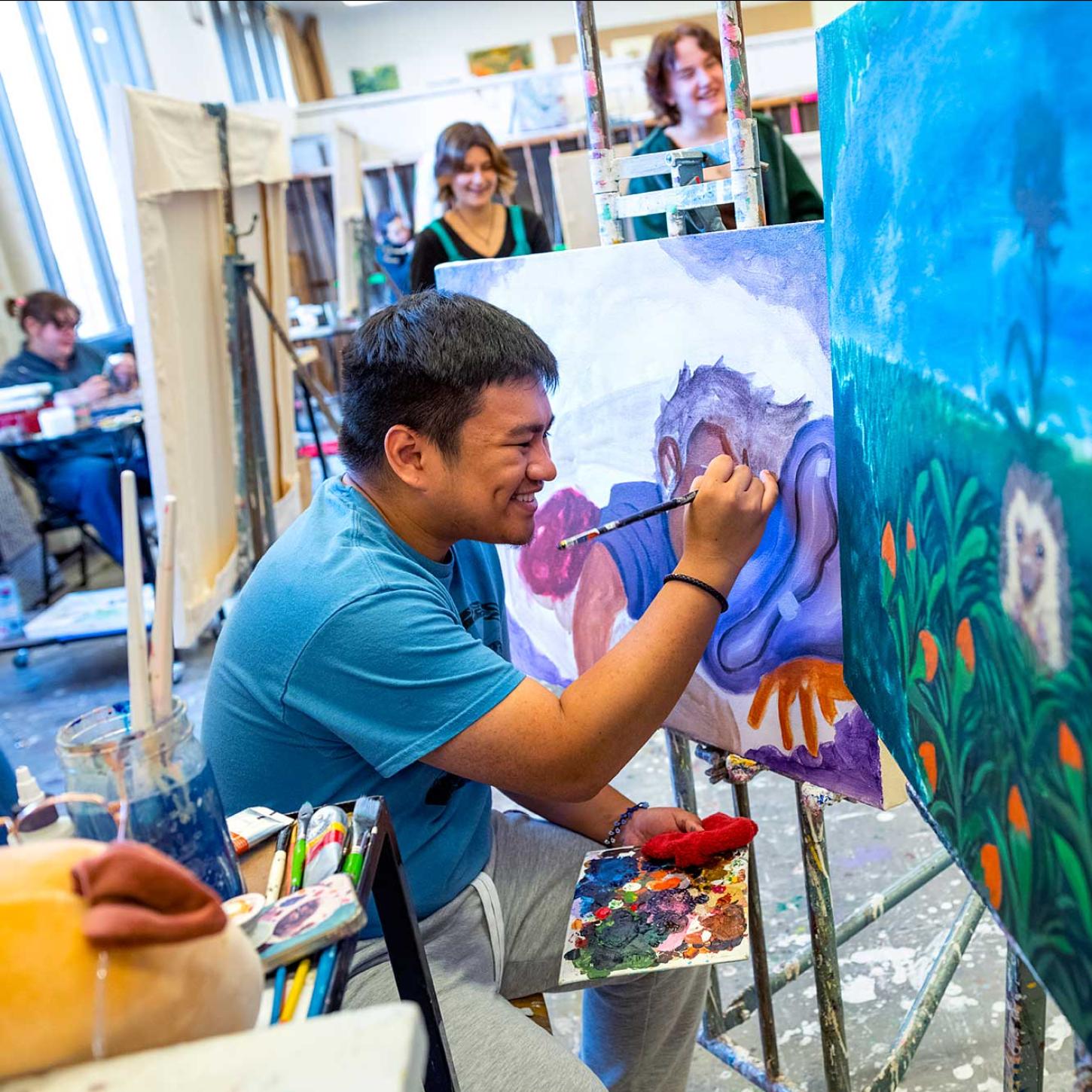 Person working on a painting