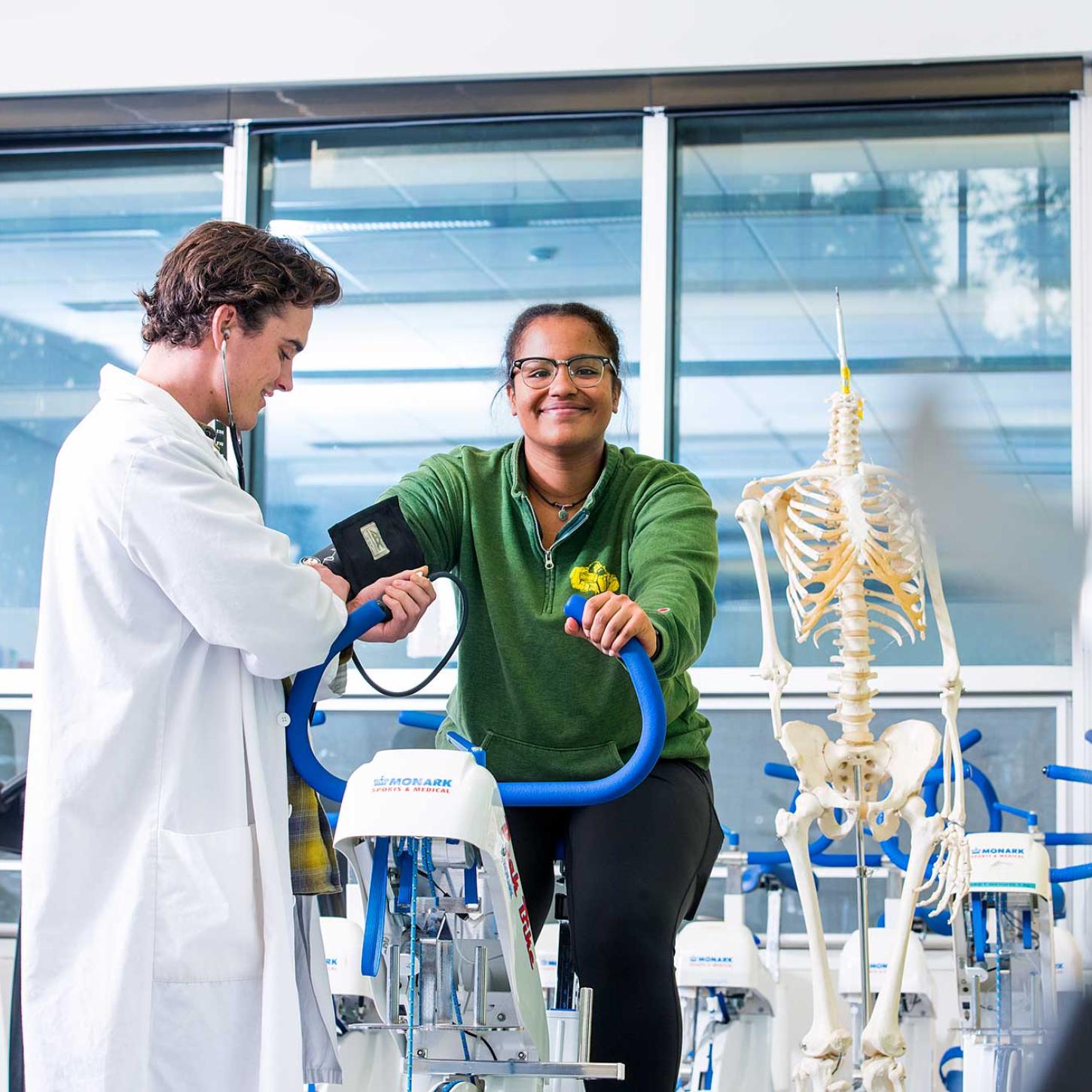 Student on exercise bike