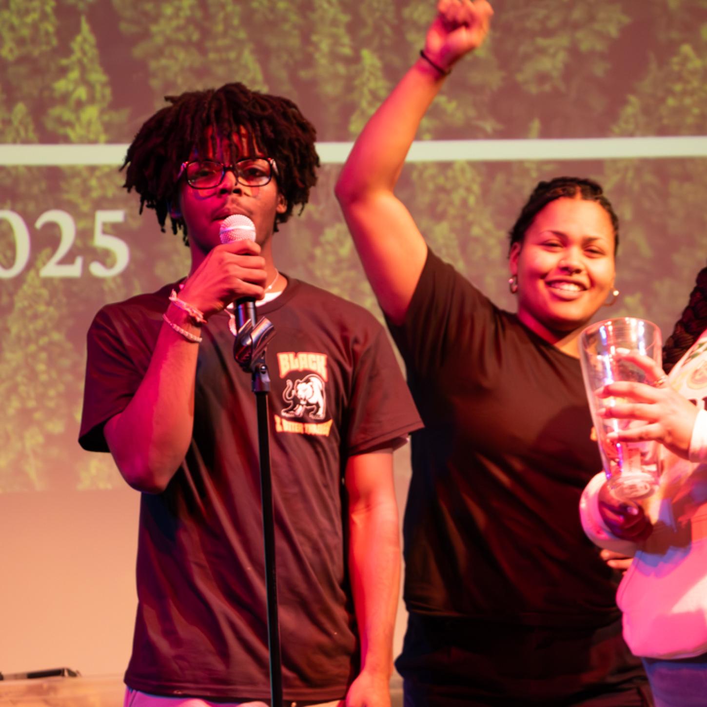 Two Student Staff facilitating the raffle at the Black Liberation Month kickoff