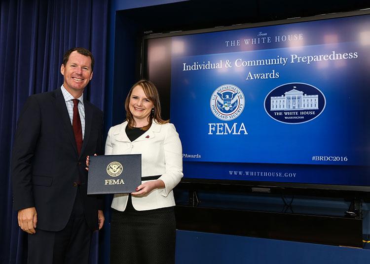 HSU Alumna Jenny Novak receiving an award from FEMA deputy administrator Tim Manning. HSU Alumna Jenny Novak receiving an award from FEMA deputy administrator Tim Manning.