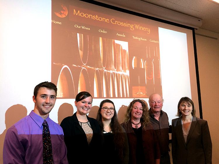 Moonstone Crossing Cancer Research Assistantship award recipients Sharon Otis, Rachel Brewer, and Logan Bailey post with winery owners Don Bremm (M.S. ‘88, Natural Resources) and Sharon Hanks (B.A. ‘79), and Amy Sprowles, professor of Biological Sciences. Moonstone Crossing Cancer Research Assistantship award recipients Sharon Otis, Rachel Brewer, and Logan Bailey post with winery owners Don Bremm (M.S. ‘88, Natural Resources) and Sharon Hanks (B.A. ‘79), and Amy Sprowles, professor of Biological Sciences.