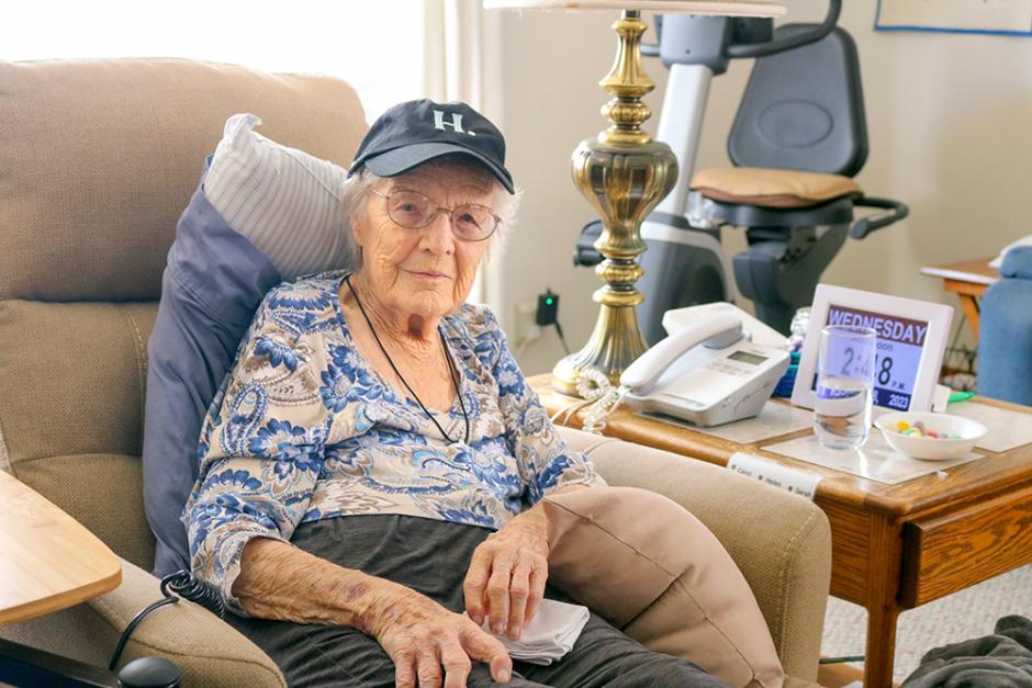 A photo of 102-year-old alum Sarah Franklin sitting on a chair wearing a Humboldt &amp;quot;H dot&amp;quot; baseball cap. 