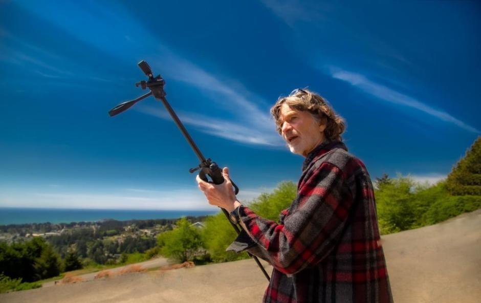 A photo of Ray Olson holding a tripod while filming an episode of Humboldt Outdoors. A photo of Ray Olson holding a tripod while filming an episode of Humboldt Outdoors.