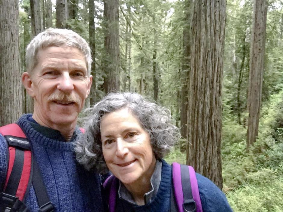 Eric Wier and Laura Frank hiking in the woods. Eric Wier and Laura Frank hiking in the woods.