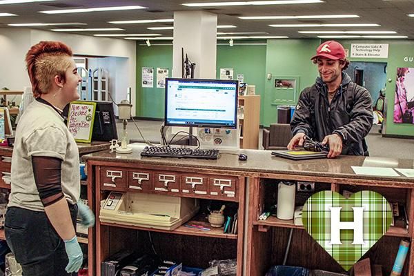 A HSU student checks out a laptop for distance learning. Donor funds have helped provide more laptops available from the Library. 