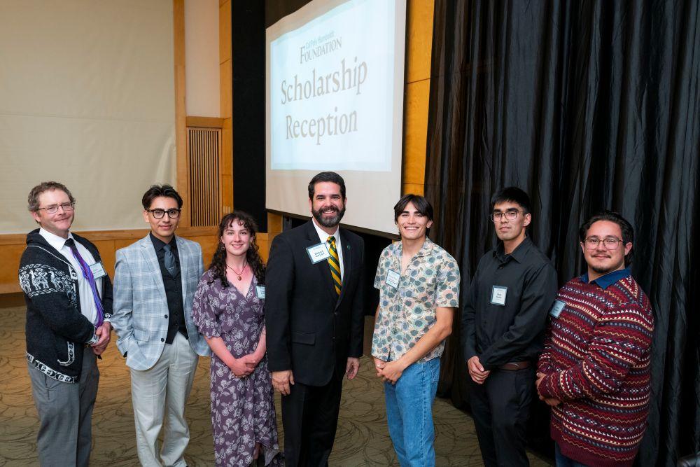 A photo of Cal Poly Humboldt President Richard Carvajal and students who have received scholarships at the annual Scholarship Reception. 