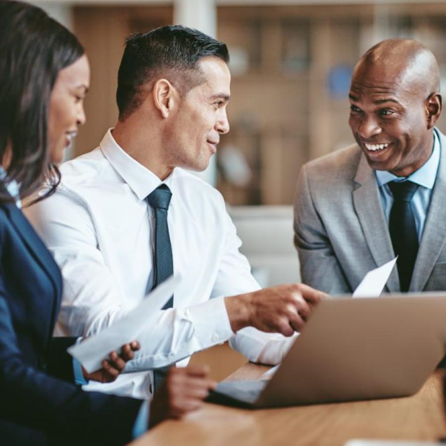 Three people in a meeting