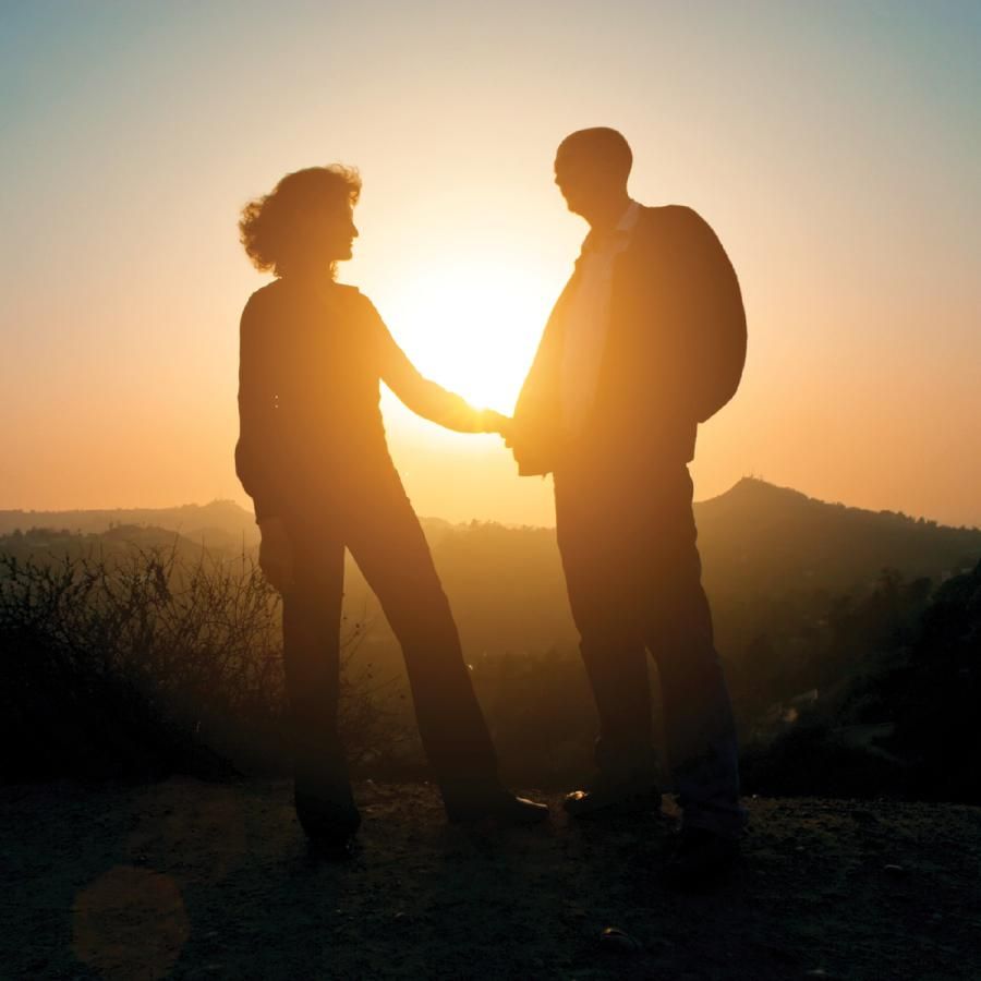 Older couple watching sunset