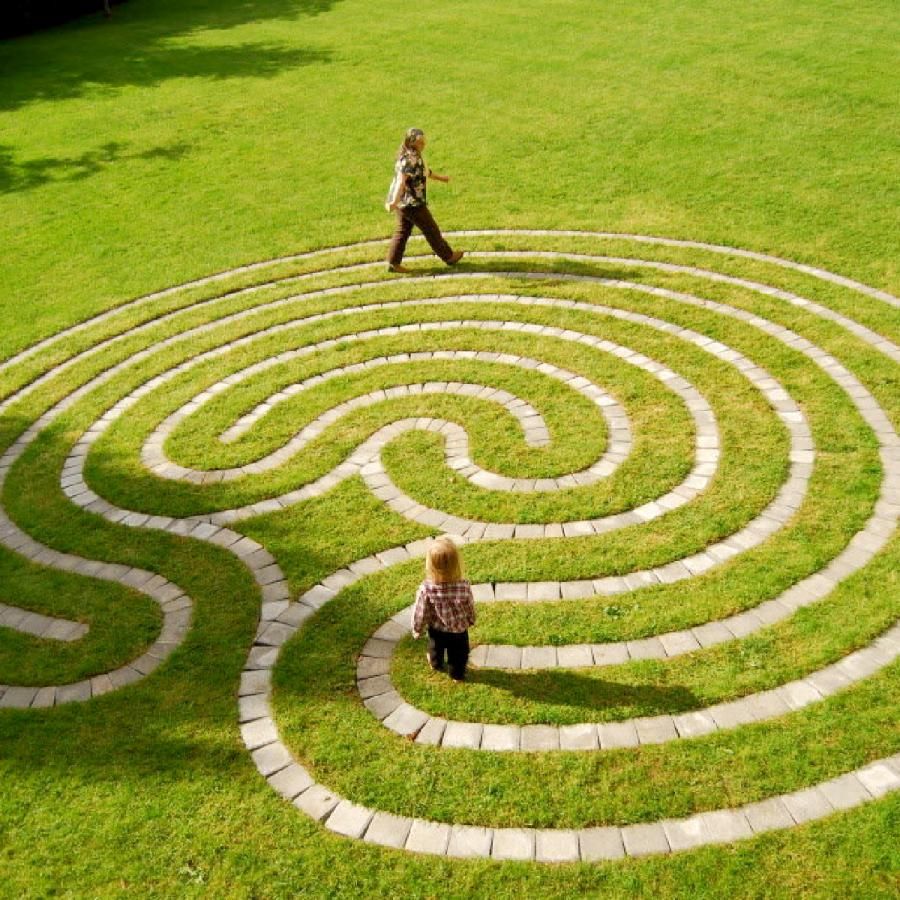 Woman and child walking on a labrynth