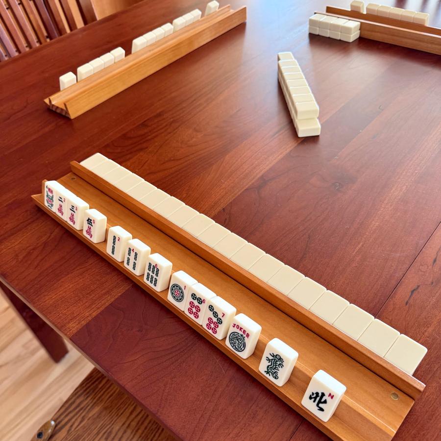 Racks of mahjong tiles on a table
