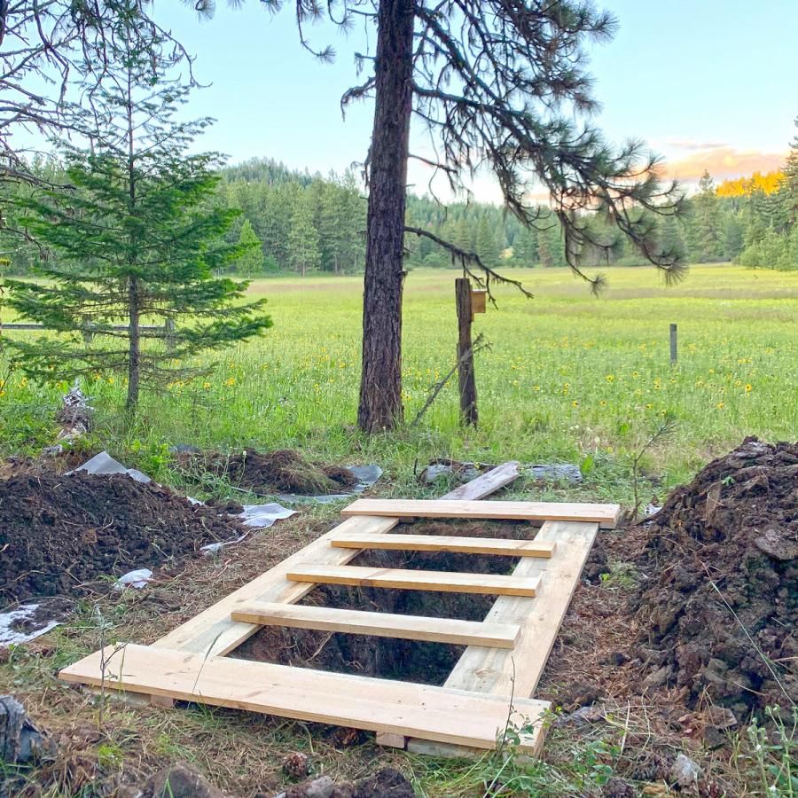 freshly dug grave in natural setting