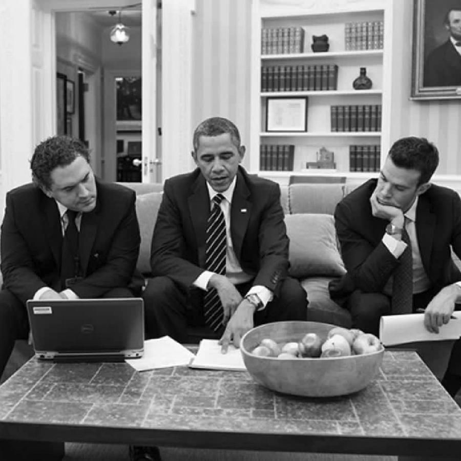 President Obama and his speechwriters working at a table