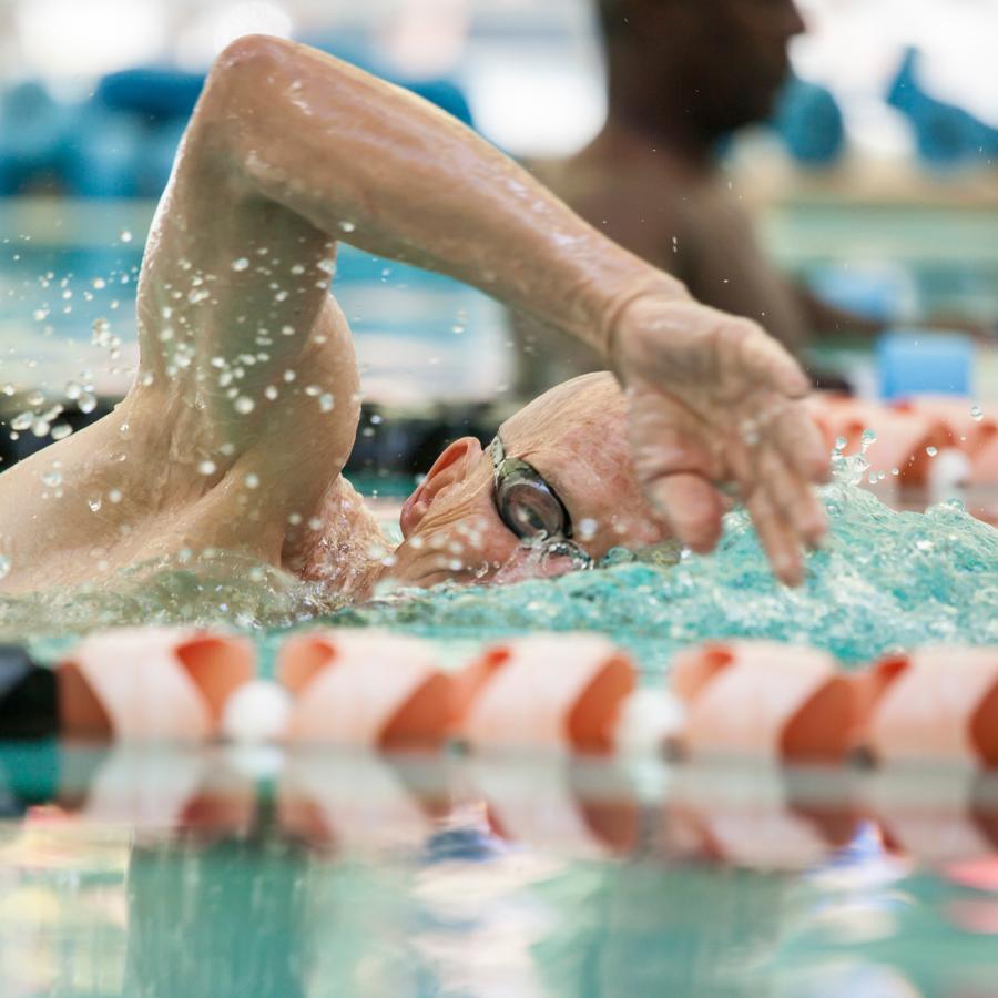 Man swimming laps in a pool Man swimming laps in a pool
