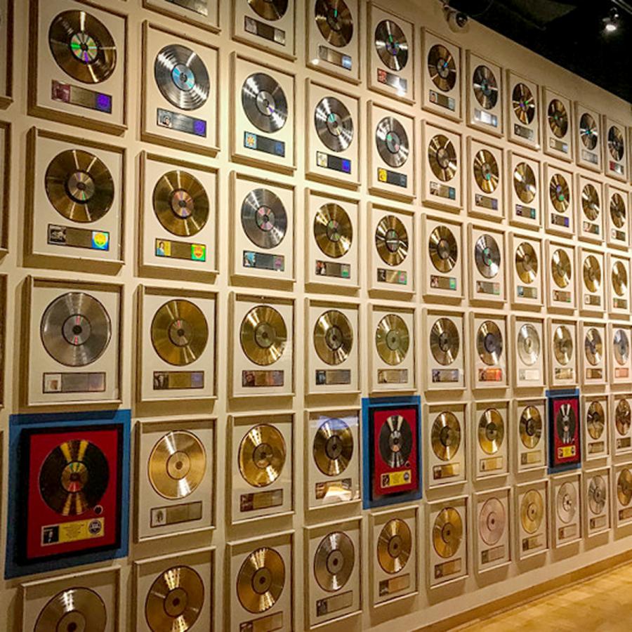 wall of framed gold and platinum records inside the Country Music Hall of Fame and Museum