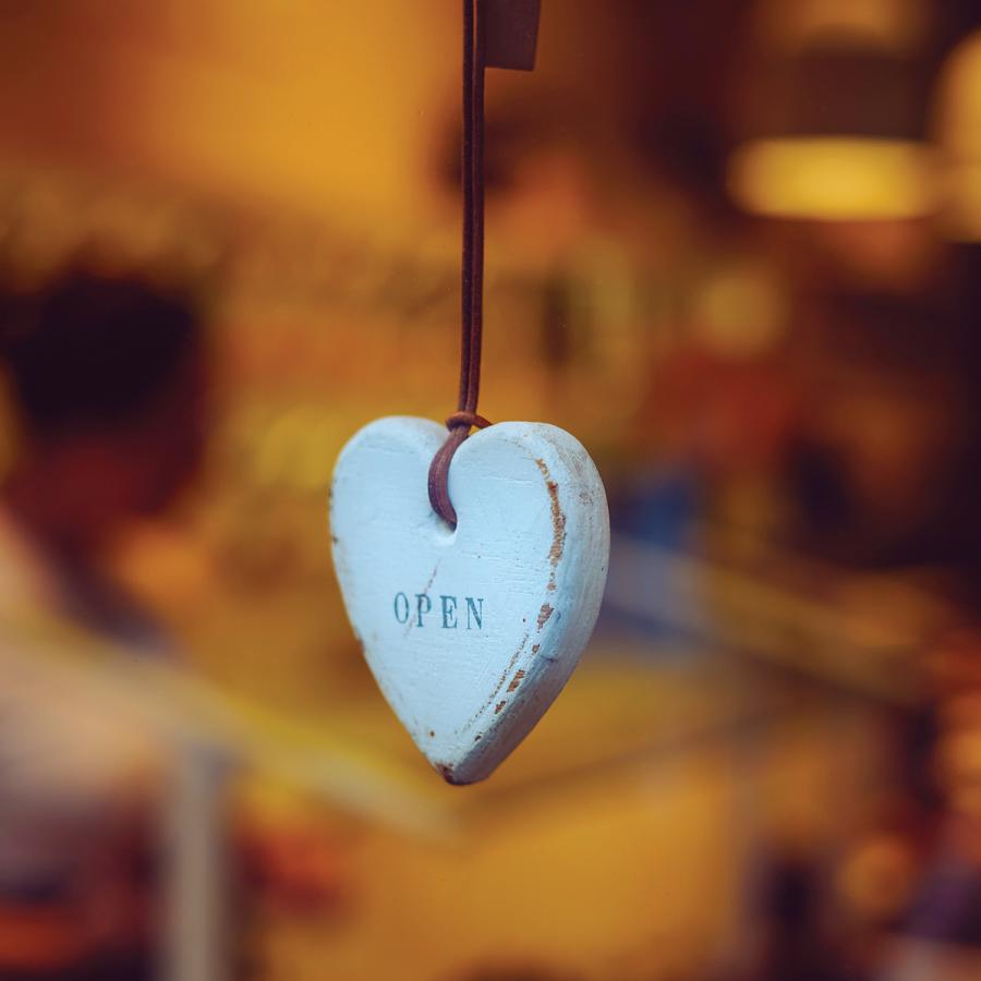 Heart shaped hanging ornament with the word "OPEN" on it