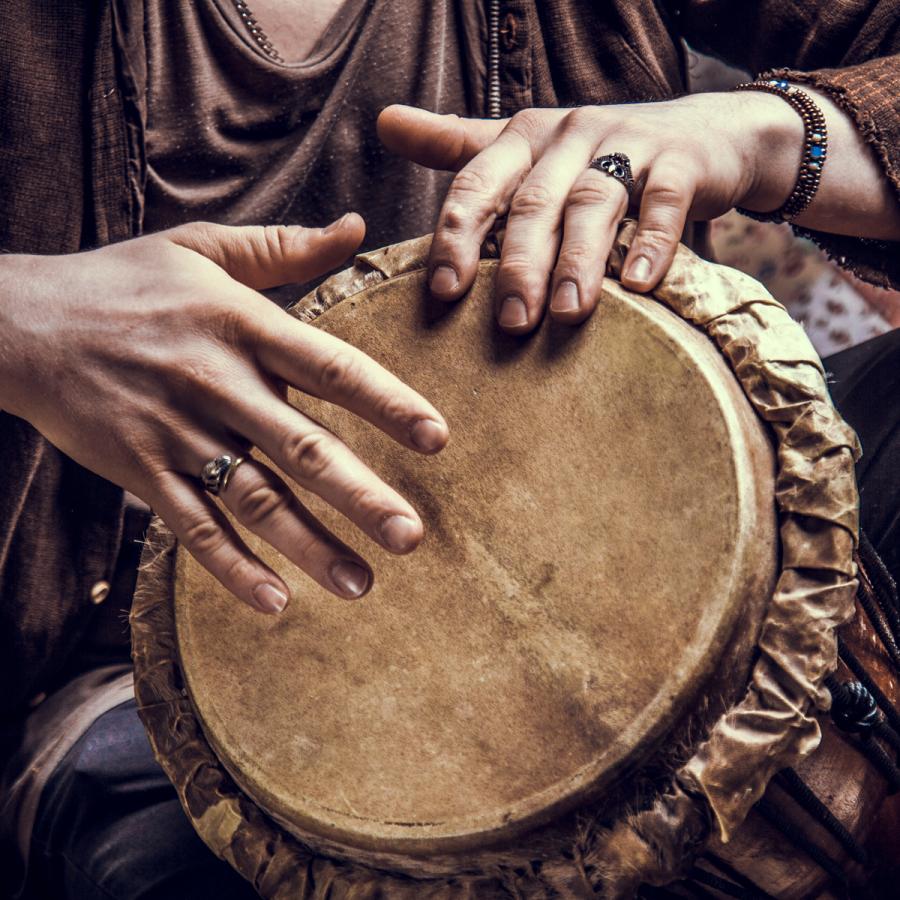 person playing a hand drum