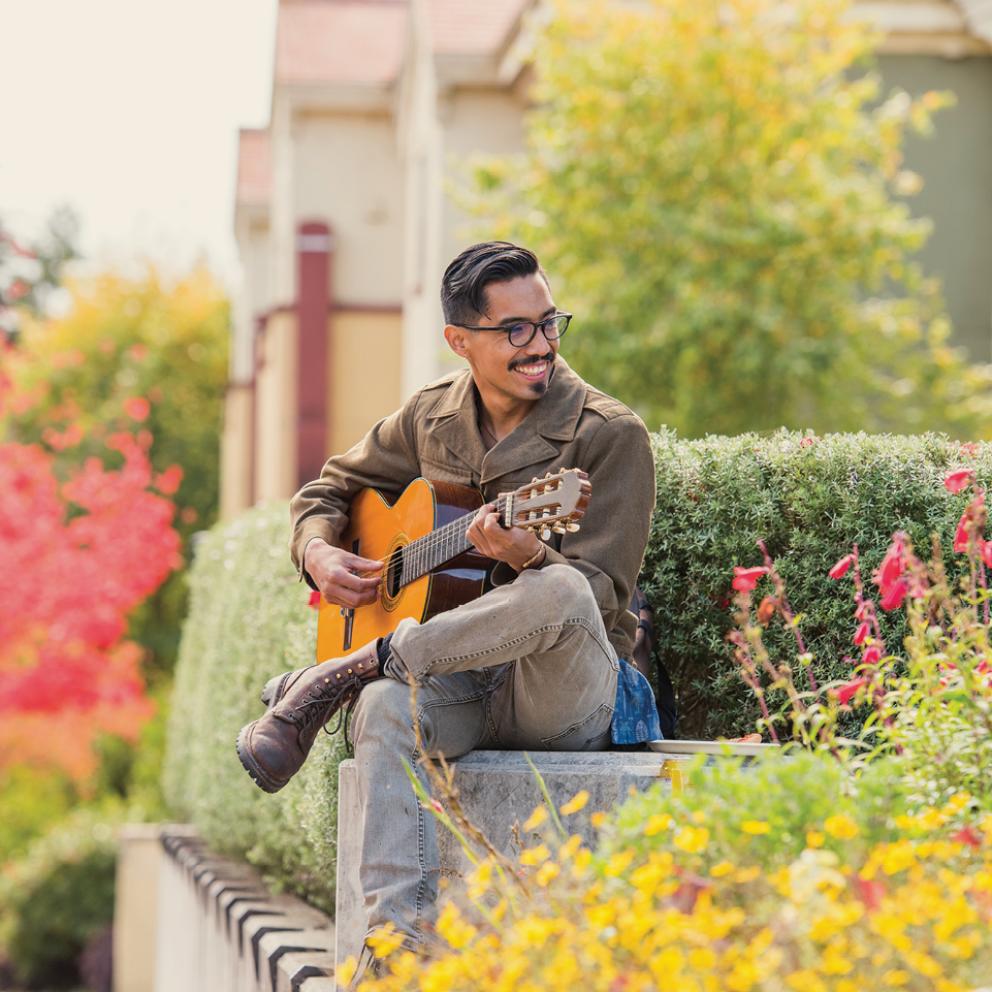 Student playing guitar