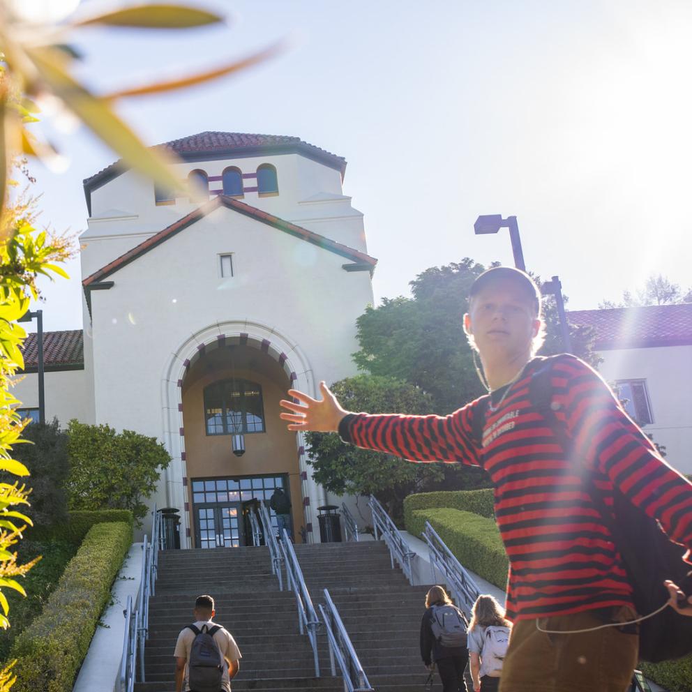 Student in front of Founders Hall