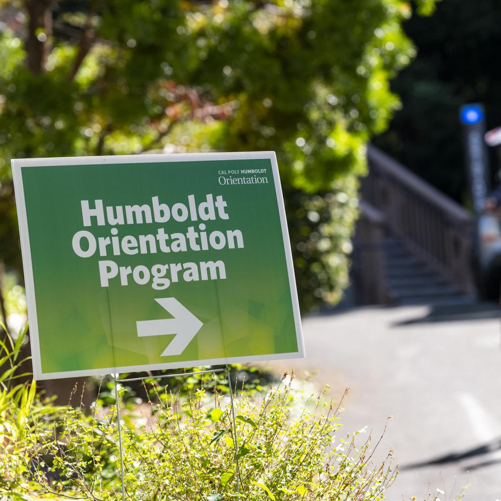 sign in the grass next to a road that says humboldt orientation program
