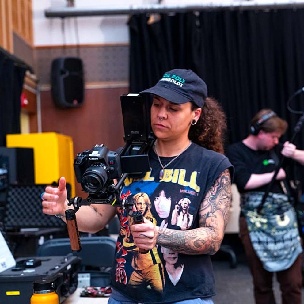 Student holding camera rig