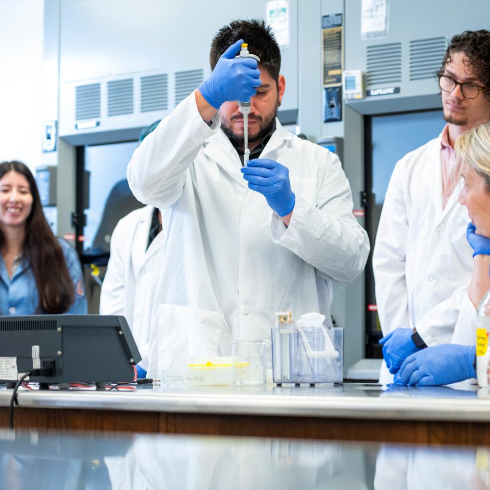 student pipetting 