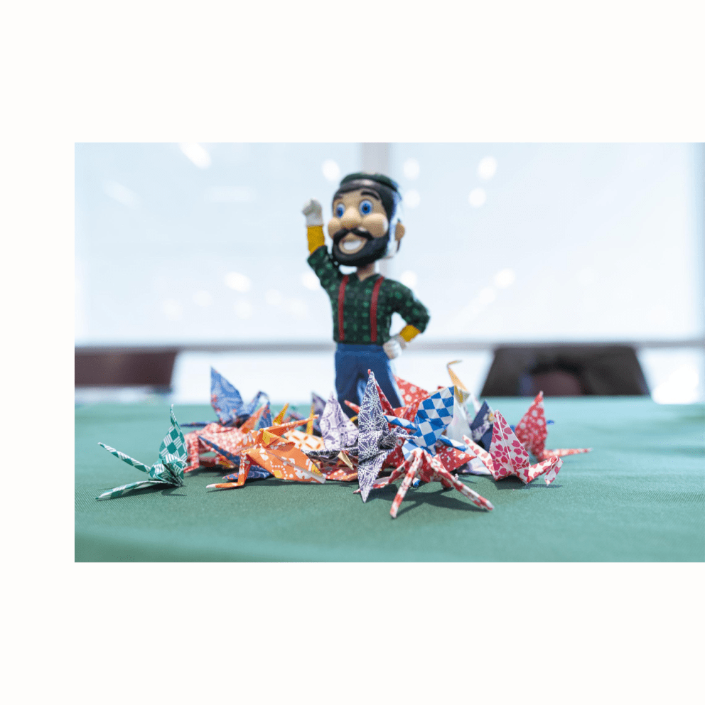 Lumberjack Statue with Origami Cranes