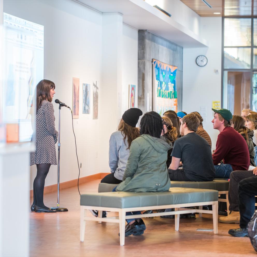 Presenter speaking in the Goudi'ni Native American Arts Gallery