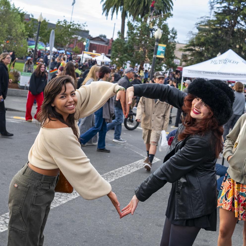 students making a heart with arms