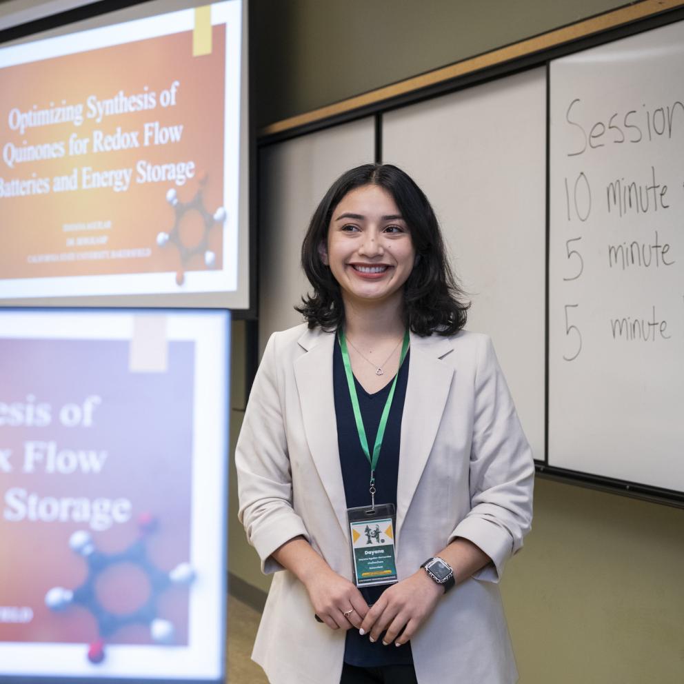 Student in front of a presentation screen
