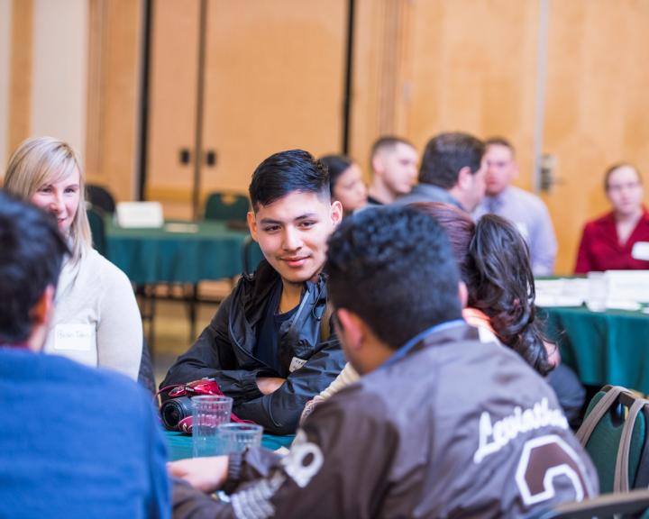 students sitting at a round table