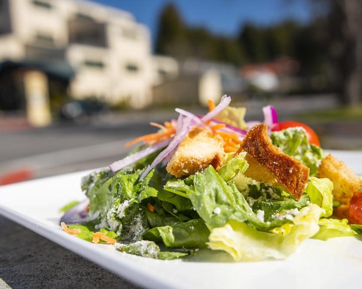 salad on a plate in an outside setting