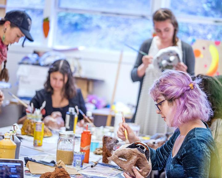 Students painting ceramics