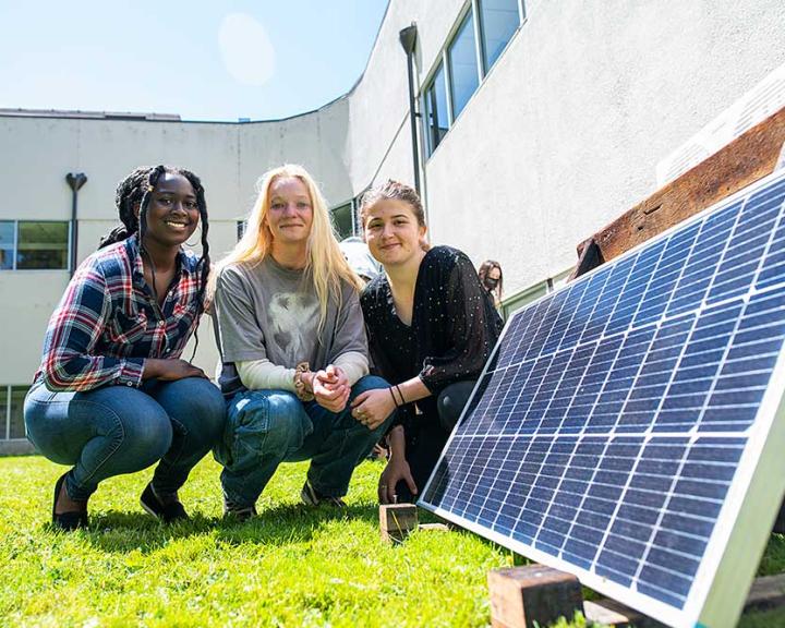 ERE student working with solar panels