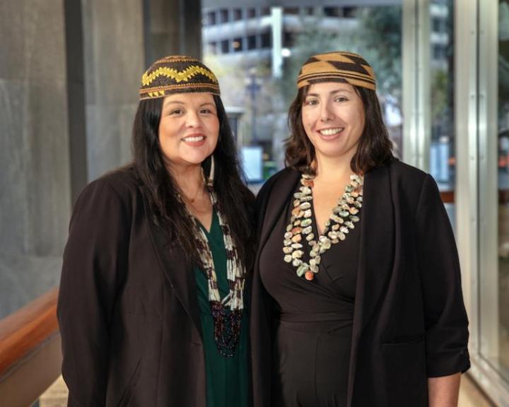 Two female professors wearing traditional