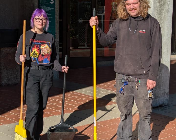 student custodians with brooms