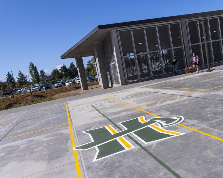 Cal Poly Humboldt logo on a pickleball court