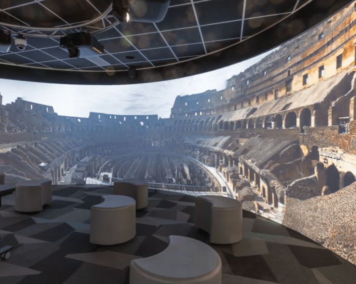 Room with wrap around screens and digital projectors