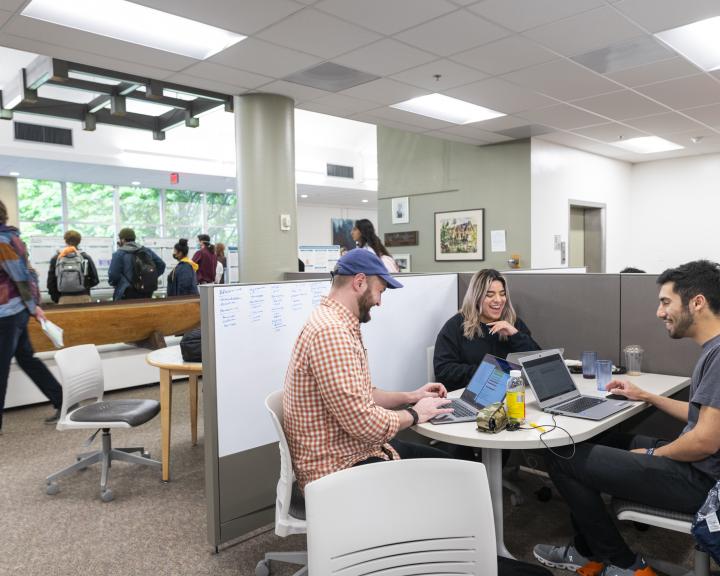 Students working at a shared table space